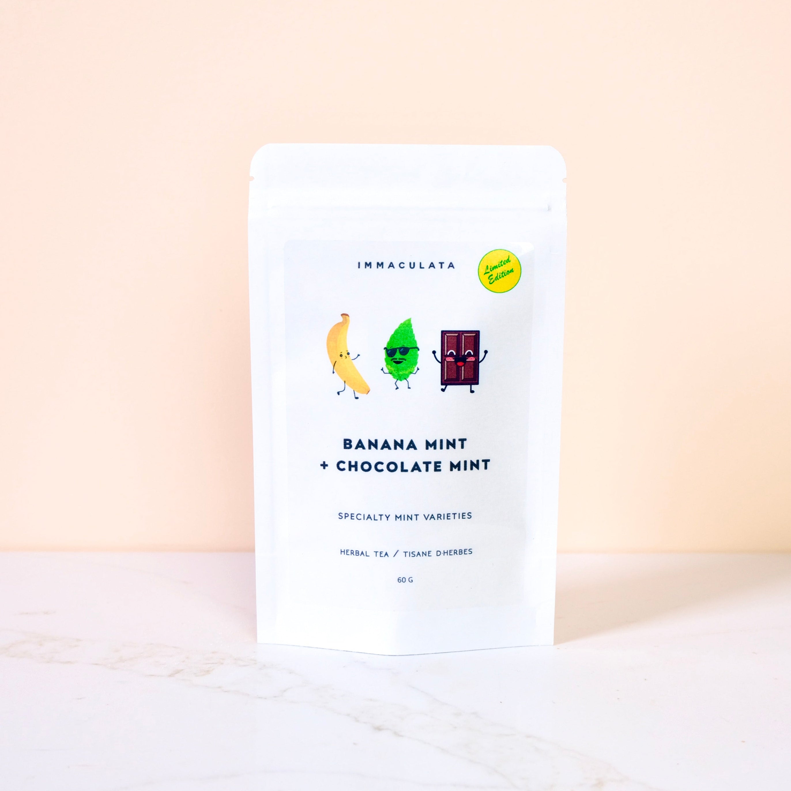 Tea package with banana, mint, and chocolate illustrations on a light background