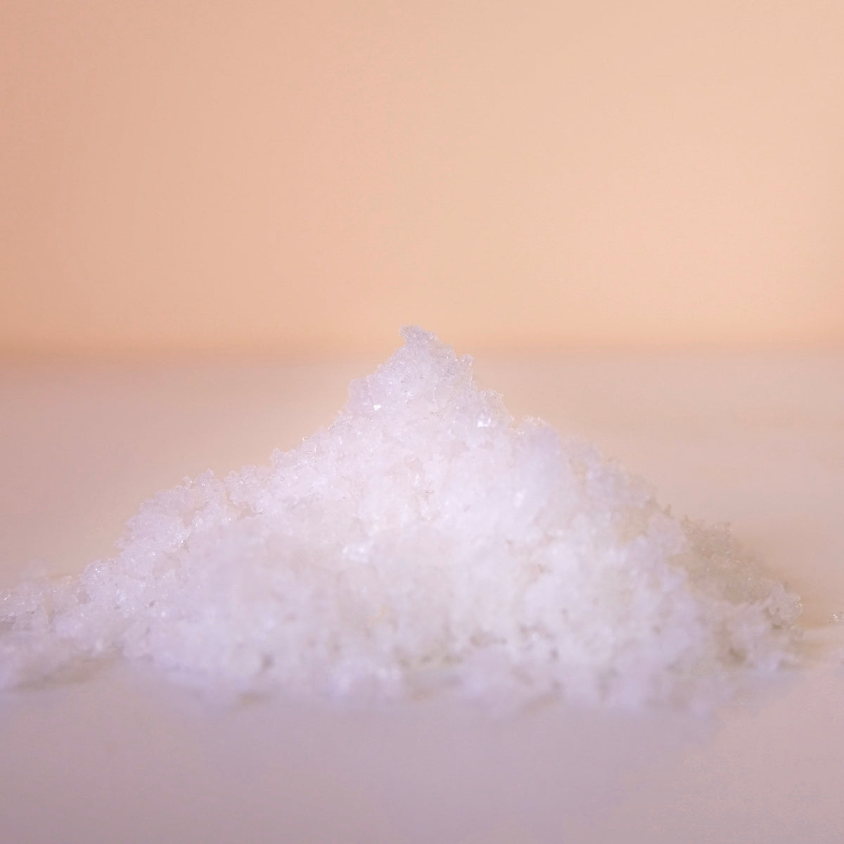 fleur de sel pile on white marble