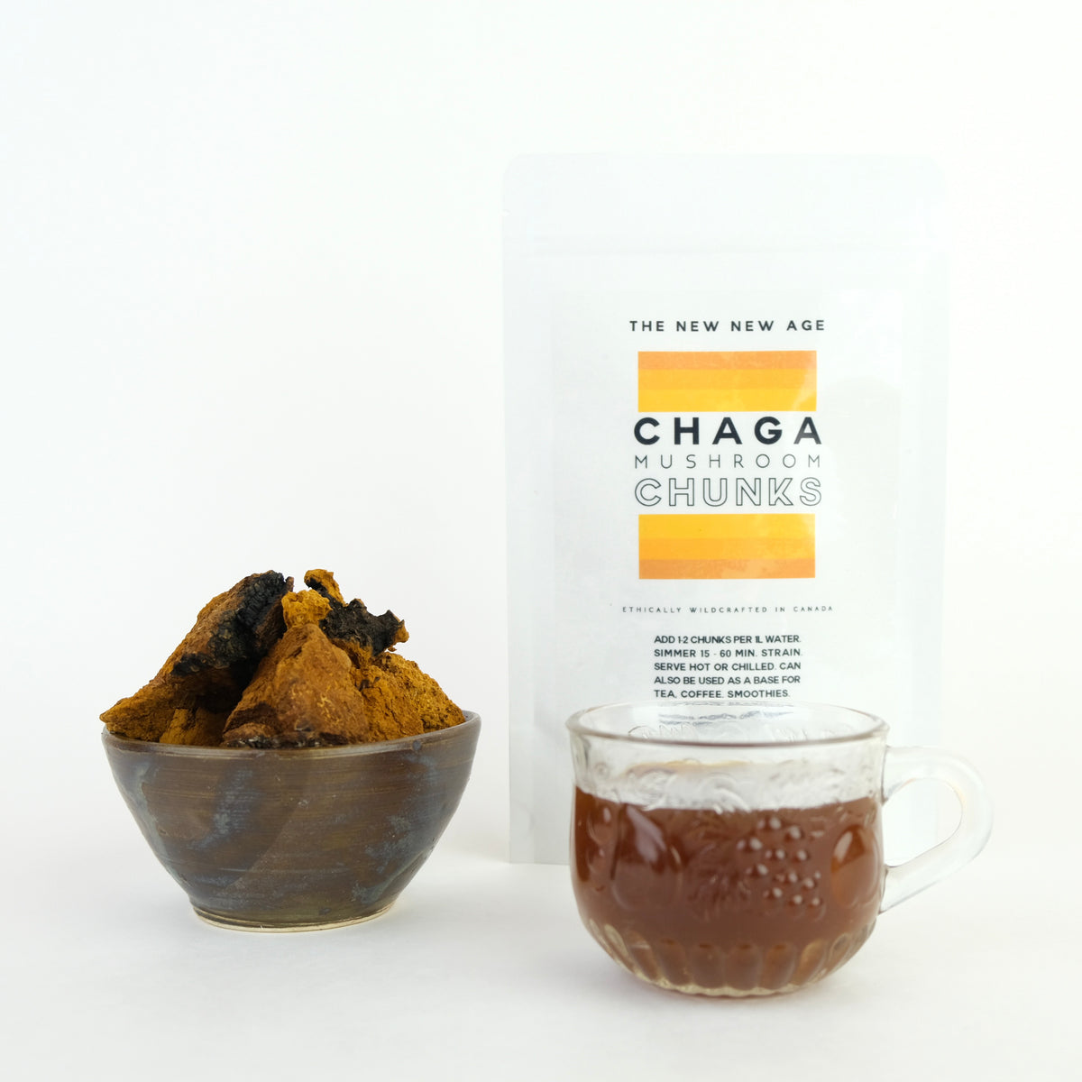 Bag of chaga mushroom for tea and cup of Chaga tea.. Chaga mushroom is a fungi that grows on birch trees. It has been used medicinally for hundreds of years & is considered the most potent antioxidant on this planet.