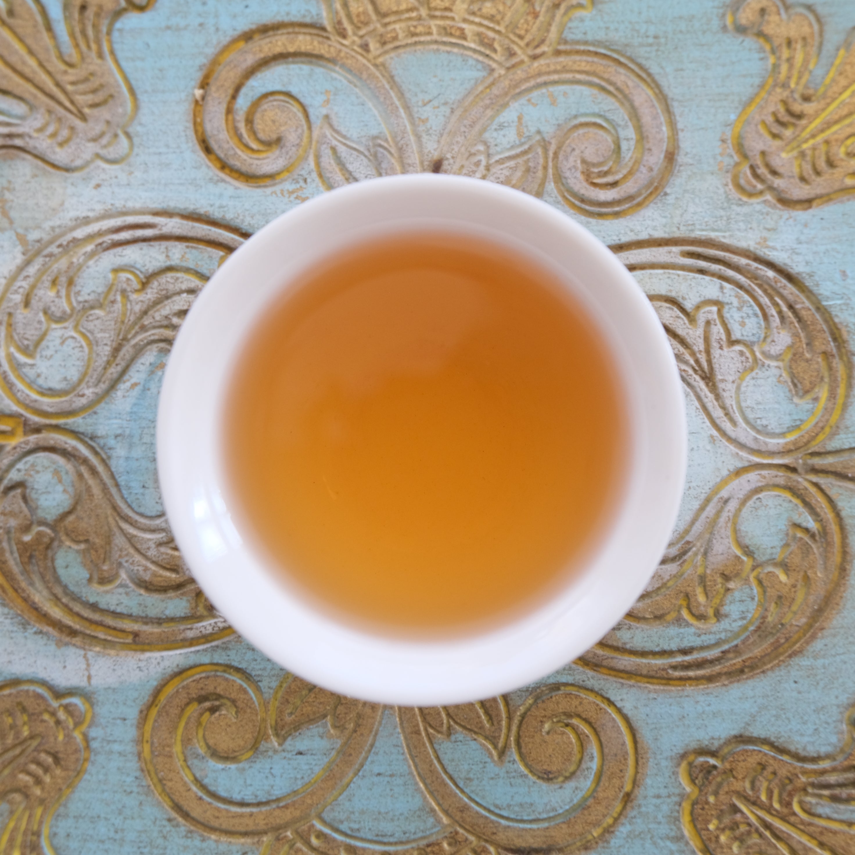 Bug-bitten oolong oriental beauty close up of liquor by Immaculata Herb Farm  and Tea Chapel