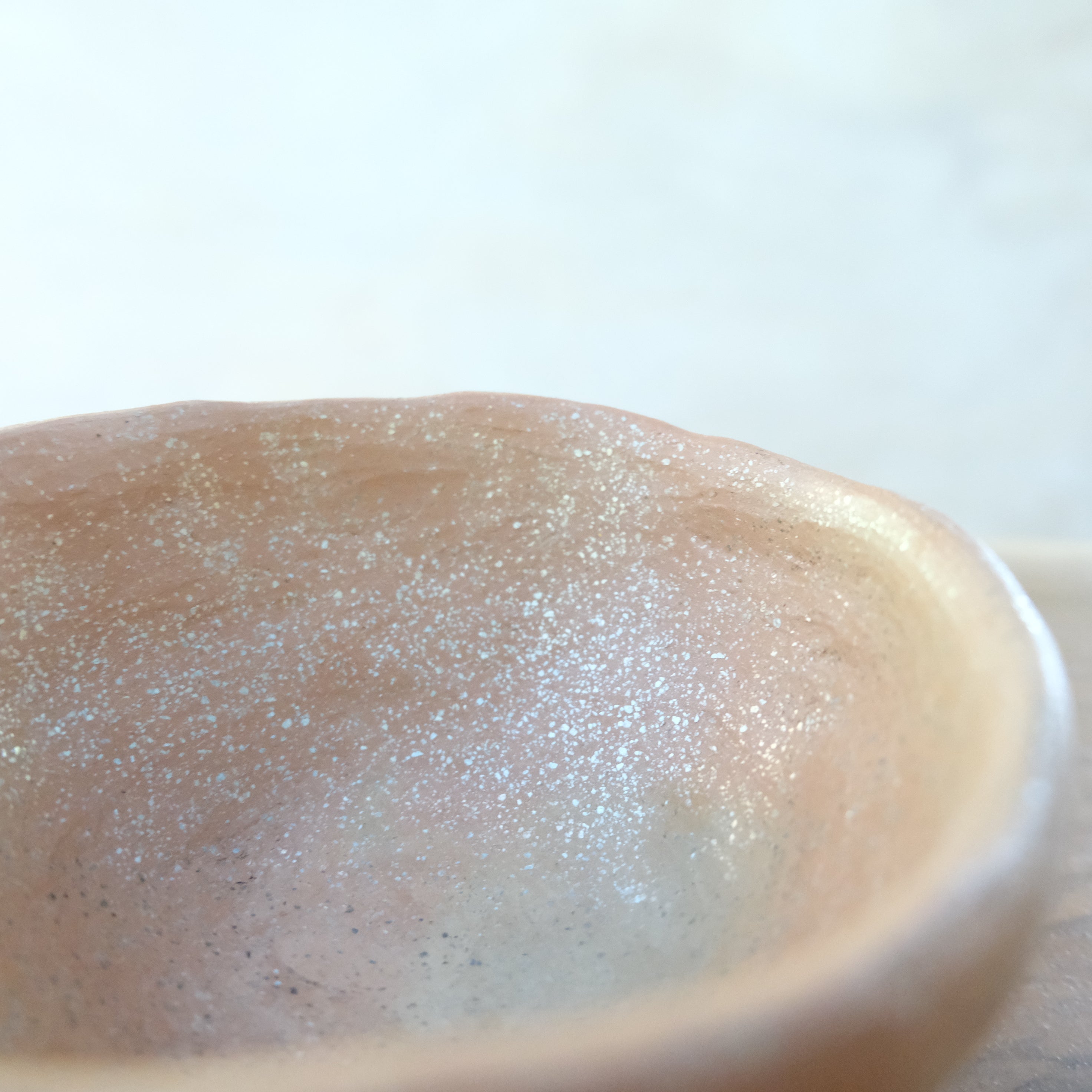 Micaceous clay earthenware tea bowl by The New New Age. 