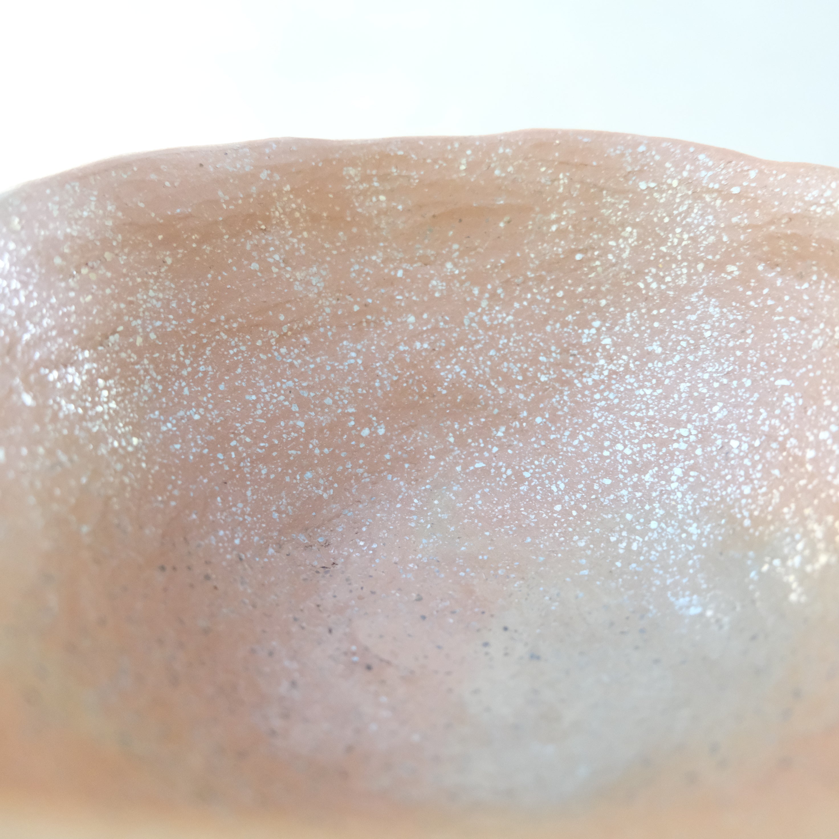 Micaceous clay earthenware tea bowl by The New New Age. 