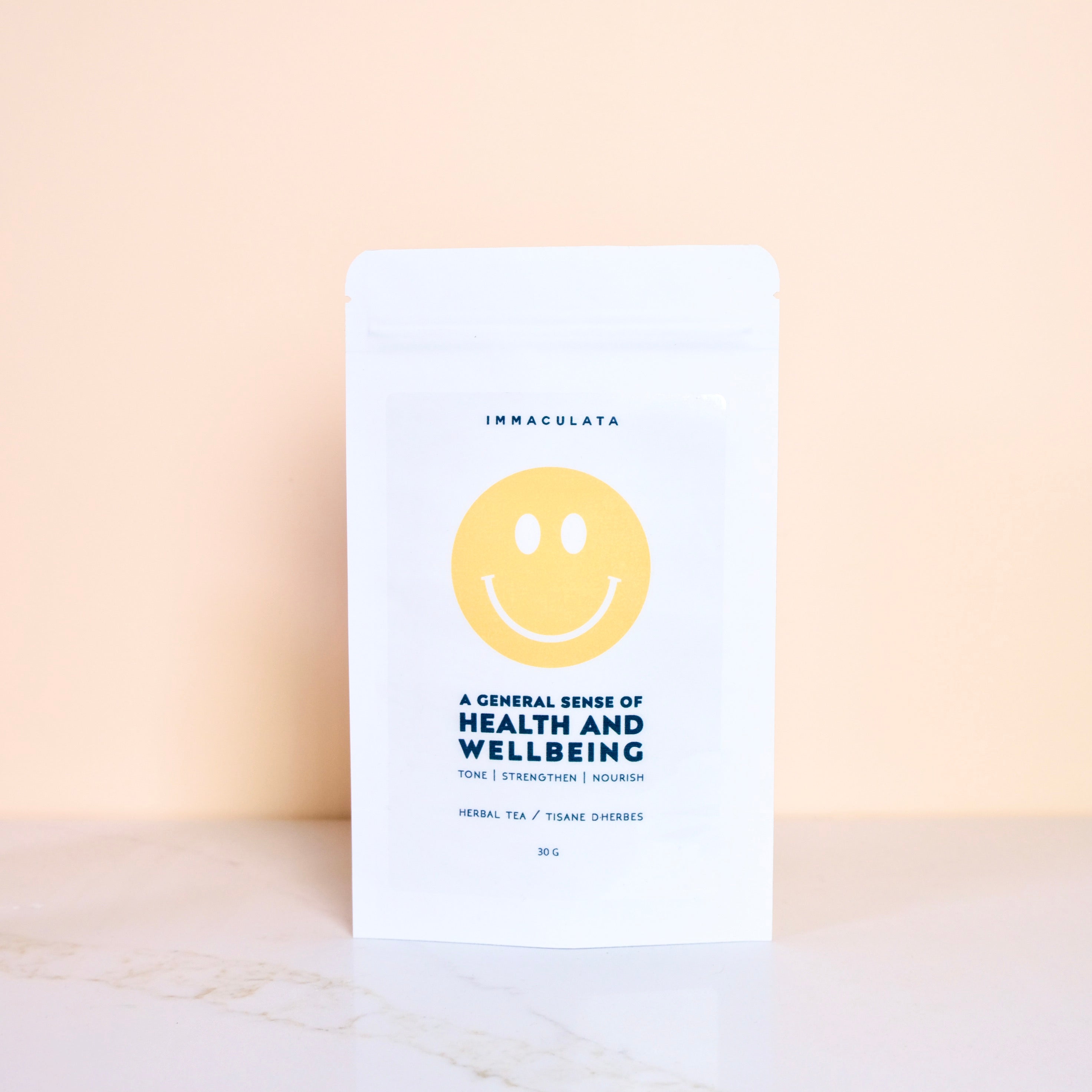 Tea package of General Sense of Health and Wellbeing by Immaculata Herb Farm with a smiley face on a light background