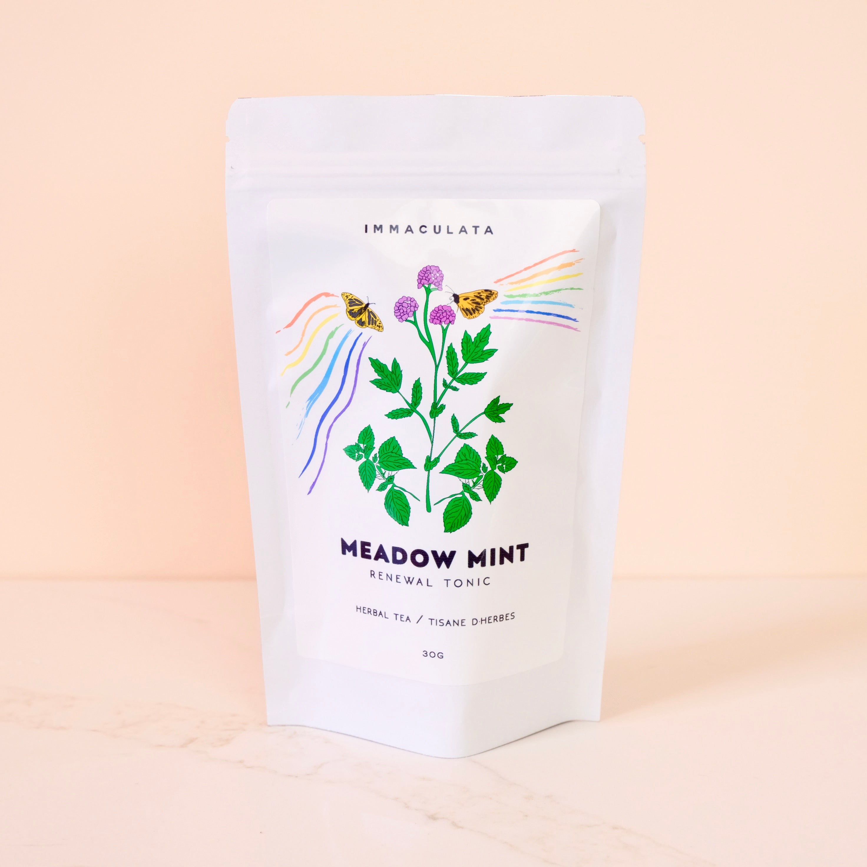 Tea package labeled 'Immaculata Meadow Mint' on a beige background