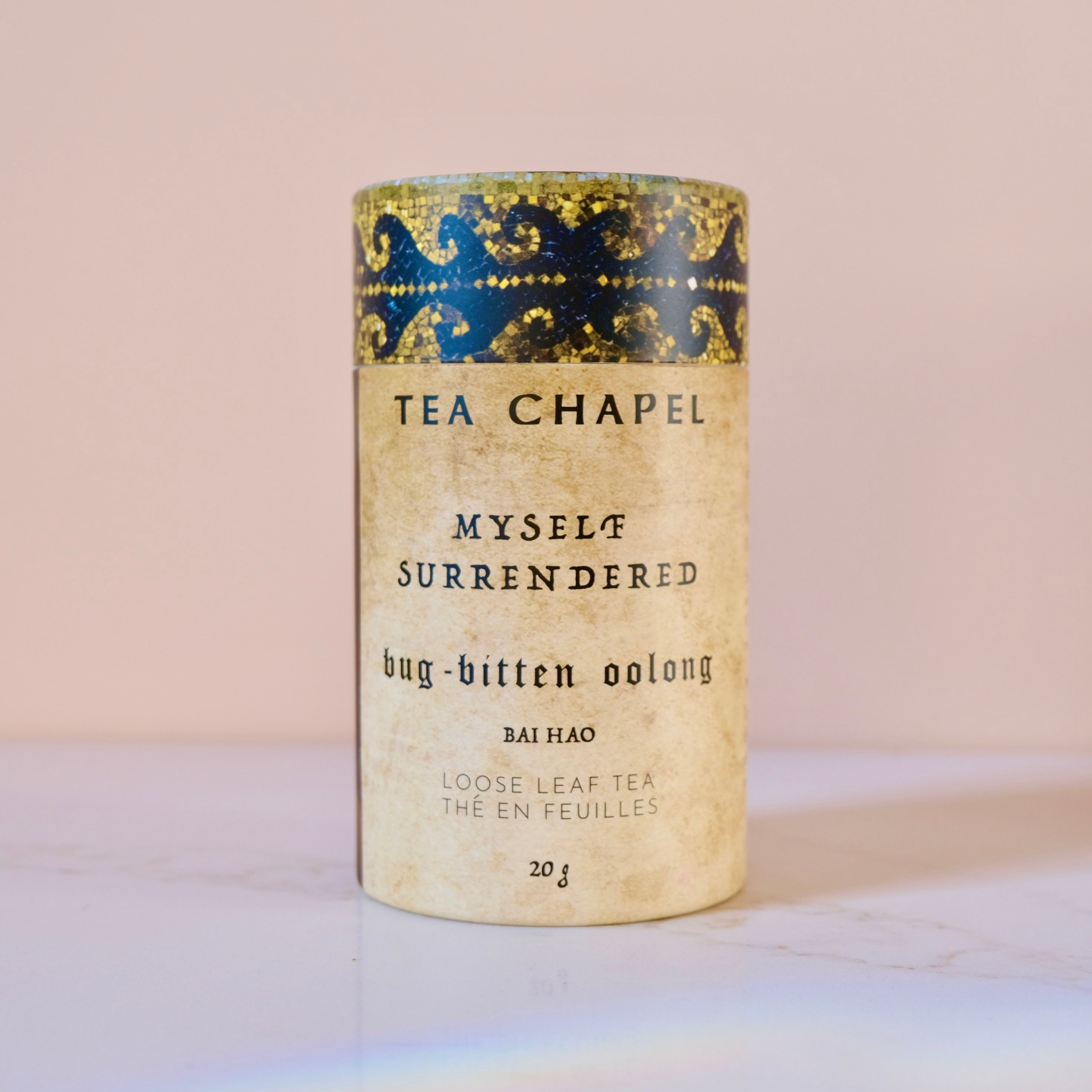Tea canister labeled 'Tea Chapel' with decorative blue band on a light background