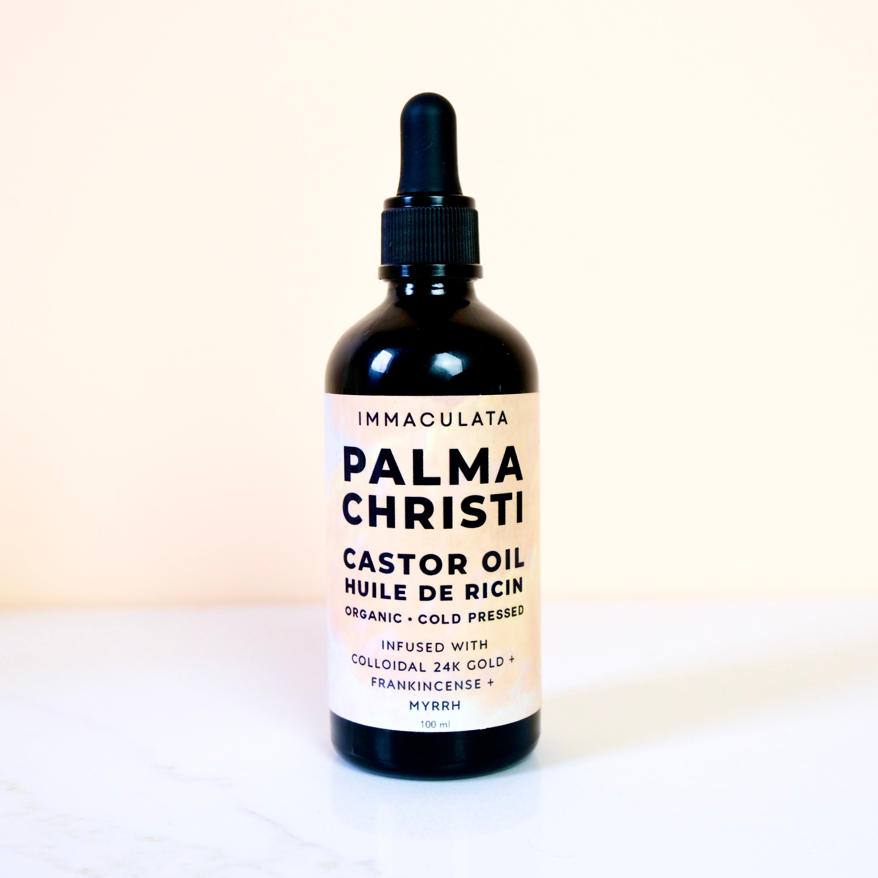 Bottle of Palma Christi Castor Oil on a white background