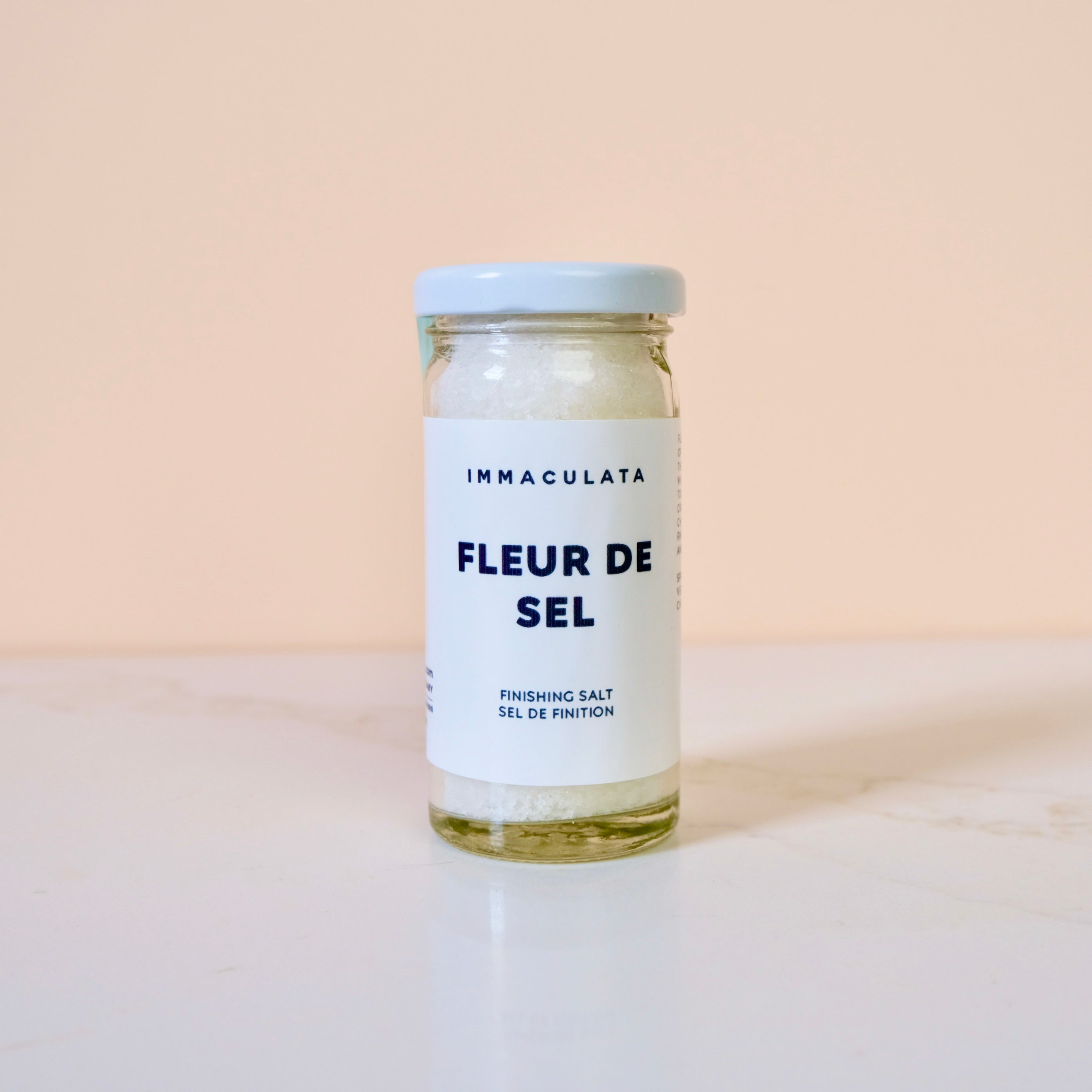 Jar of 'Fleur de Sel' seasoning on a light background