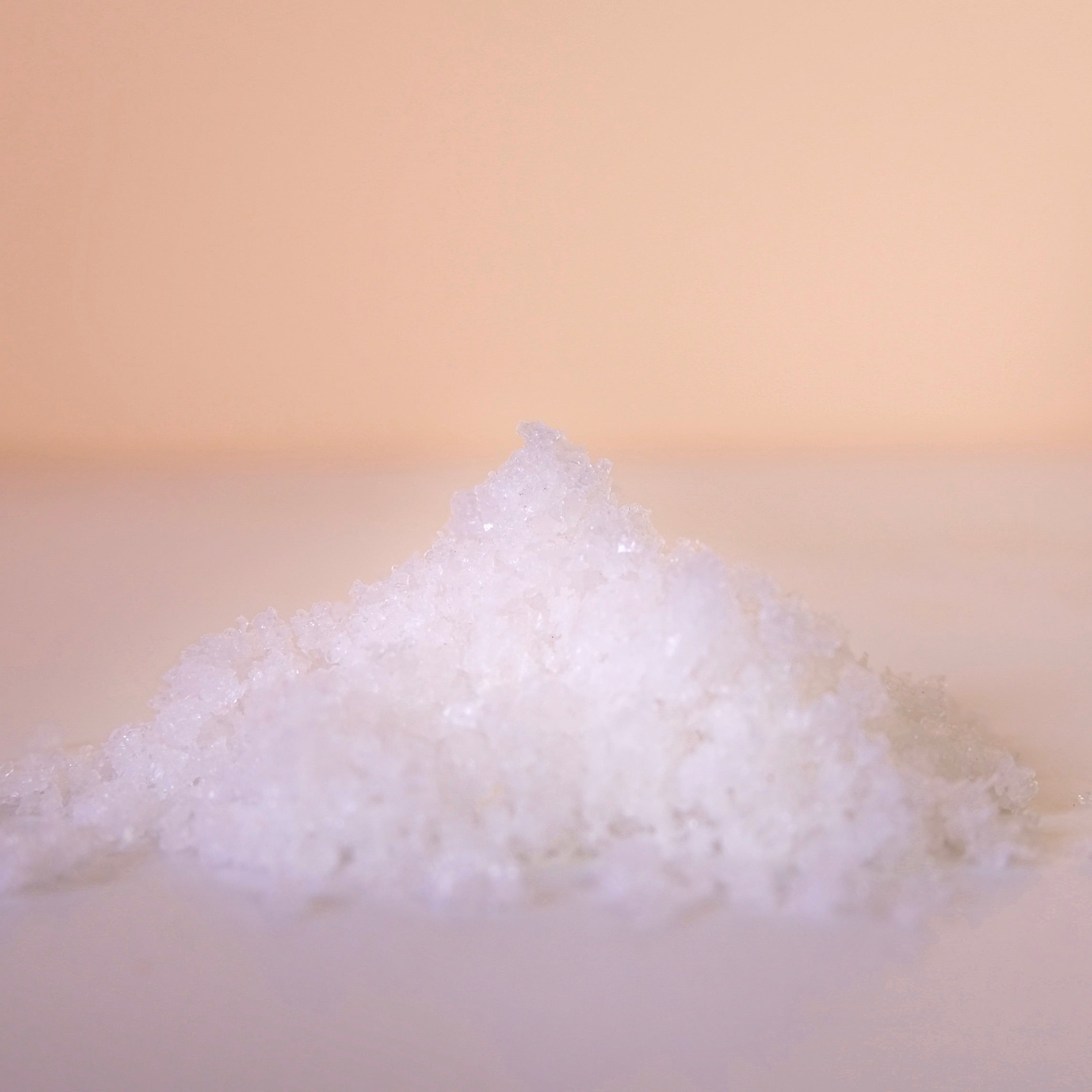 fleur de sel pile on white marble