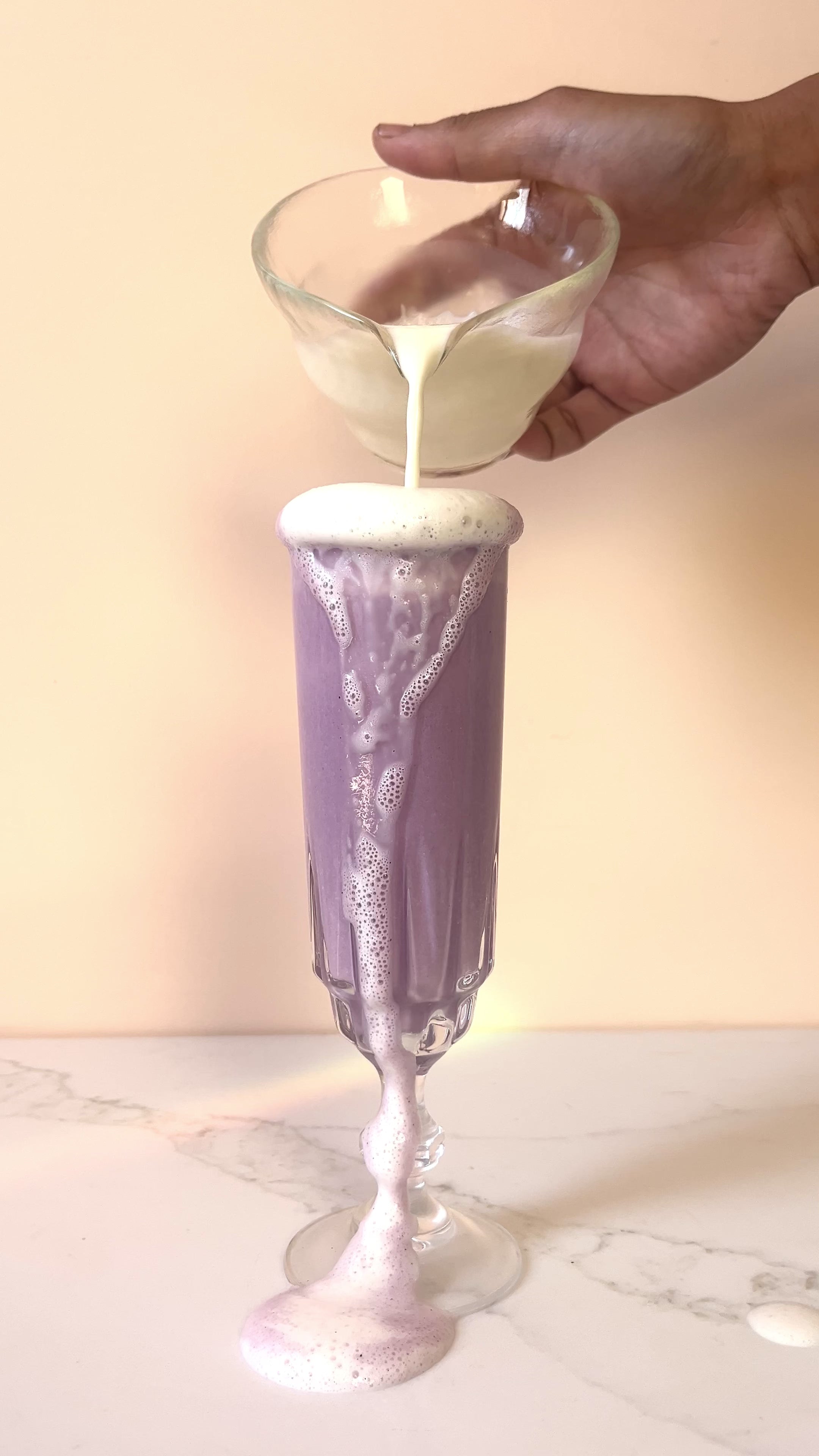 Ube Milk pouring into a glass
