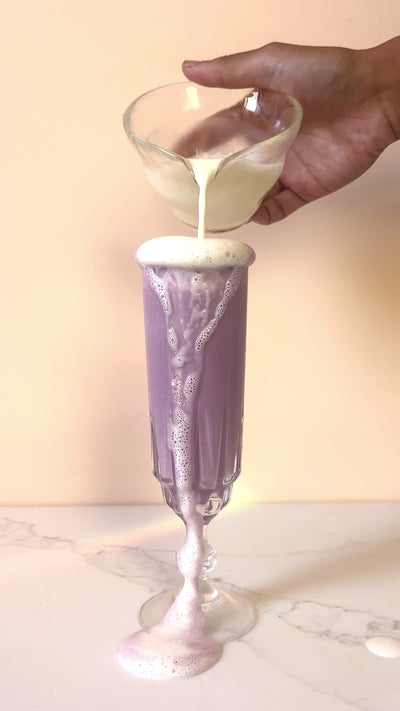 Ube Milk pouring into a glass