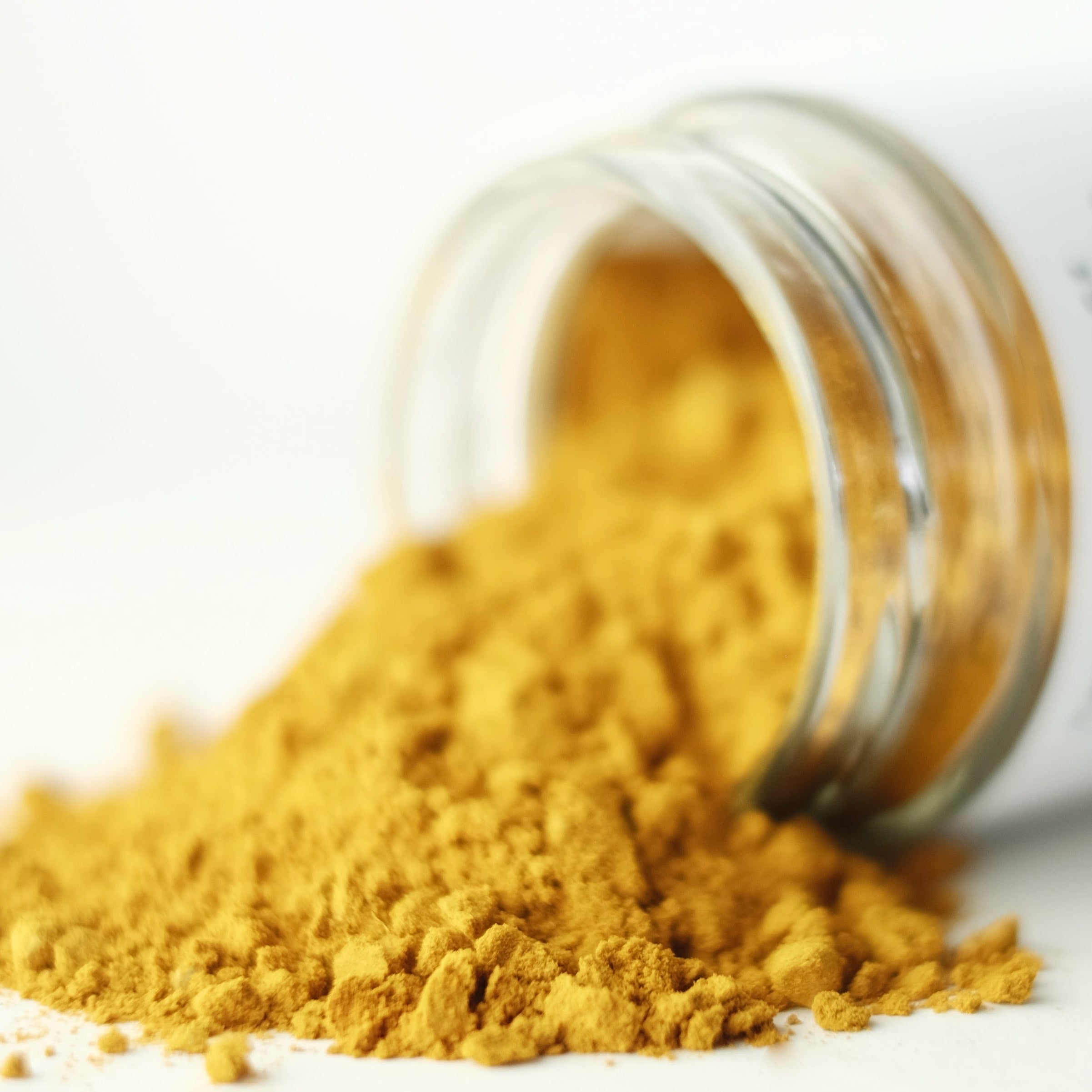 Close up of Golden Milk, an organic turmeric latte herbal powder blend made by The New New Age.