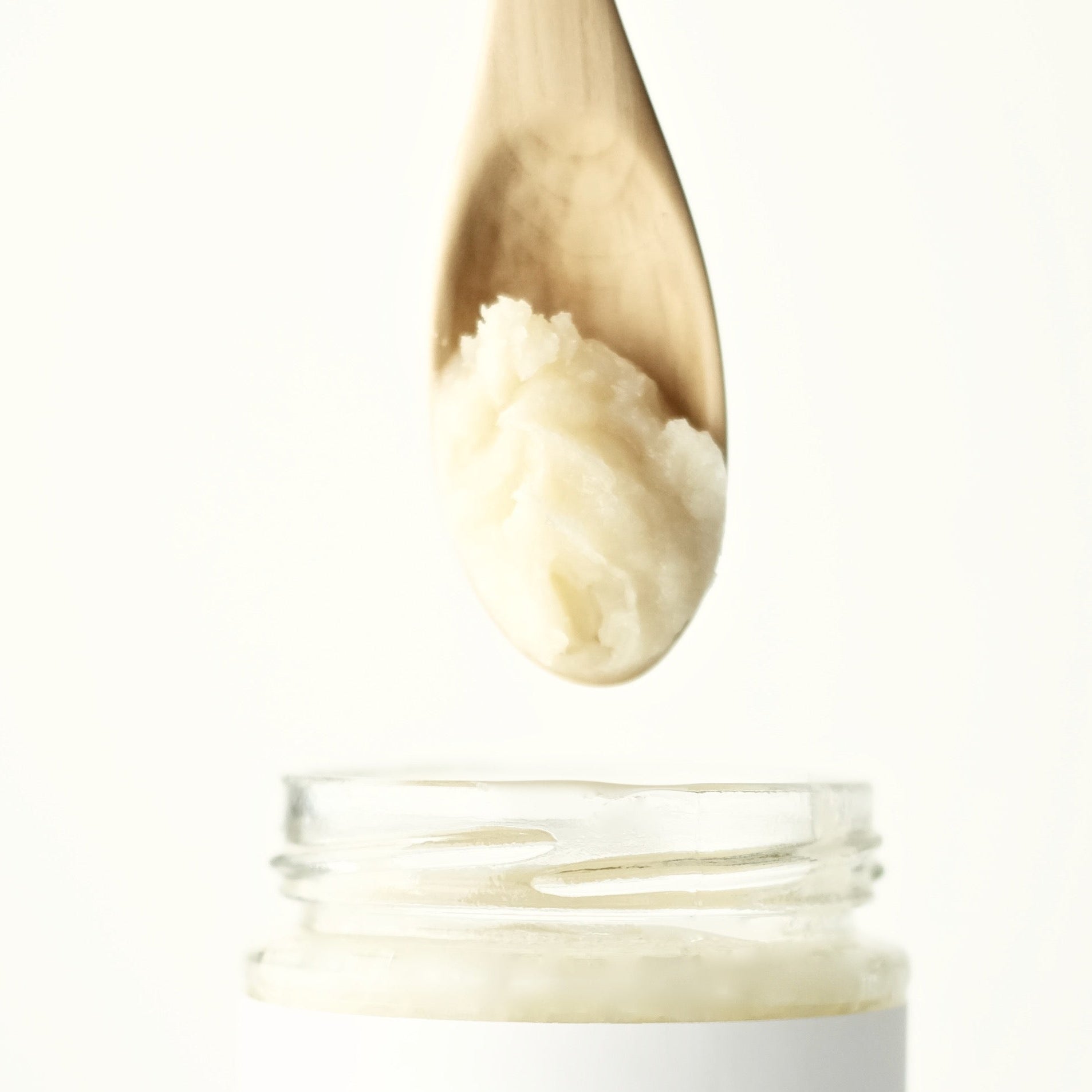 A jar of Skin Food, made of organic virgin coconut oil, raw cacao butter and unrefined, treatment-free beeswax. Formulated by The New New Age.